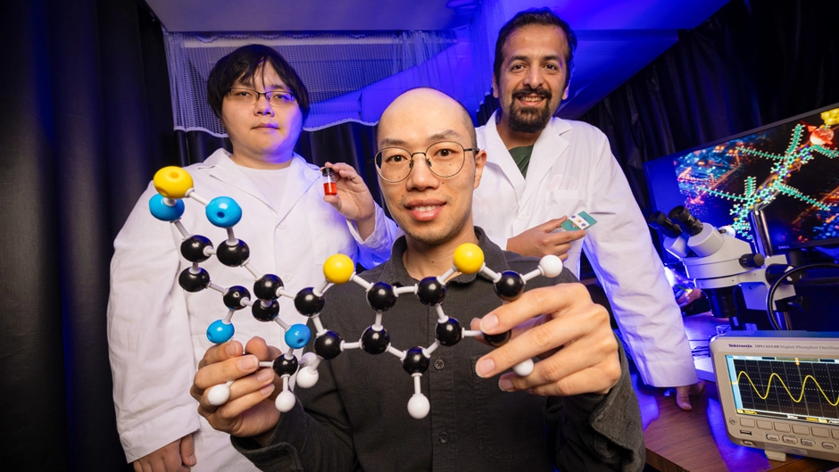 From left: Shen, Wang and Shiri with their molecule and a chemical model of it. Photos by Joshua Prezant/University of Miami.